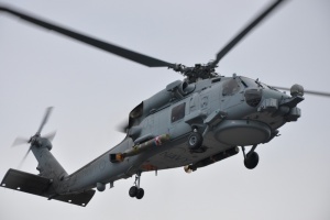 A MH-60R 'Romeo' helicopter loaded with a Mk 54 torpedo during a firing serial.