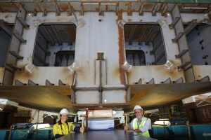 (L to R) Evyenia Kontakos, Fourth-year Apprentice welder and boilermaker from the Australian Submarine Corporation and Larry Lavallee, Offshore Patrol Vessel (OPV) Block Construction Manager, ASC Shipbuilding, after hammering in wedges to secure the Chief of Navy's ceremonial coin into place during the keel laying ceremony of Offshore Patrol Vessel 2, NUSHIP Eyre.