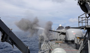 HMAS Melbourne fires her Mark 75 naval gun